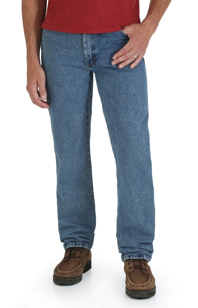 Close-up of Rustler Jeans denim fabric showing copper rivets, contrast stitching, and classic 5-pocket construction