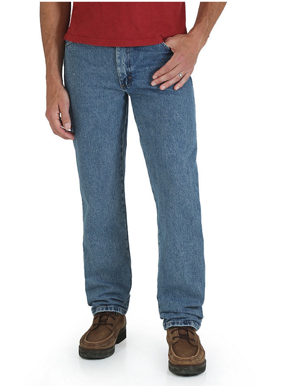 Man wearing Rustler medium stonewash relaxed fit jeans with a red shirt and brown casual shoes, front close-up view